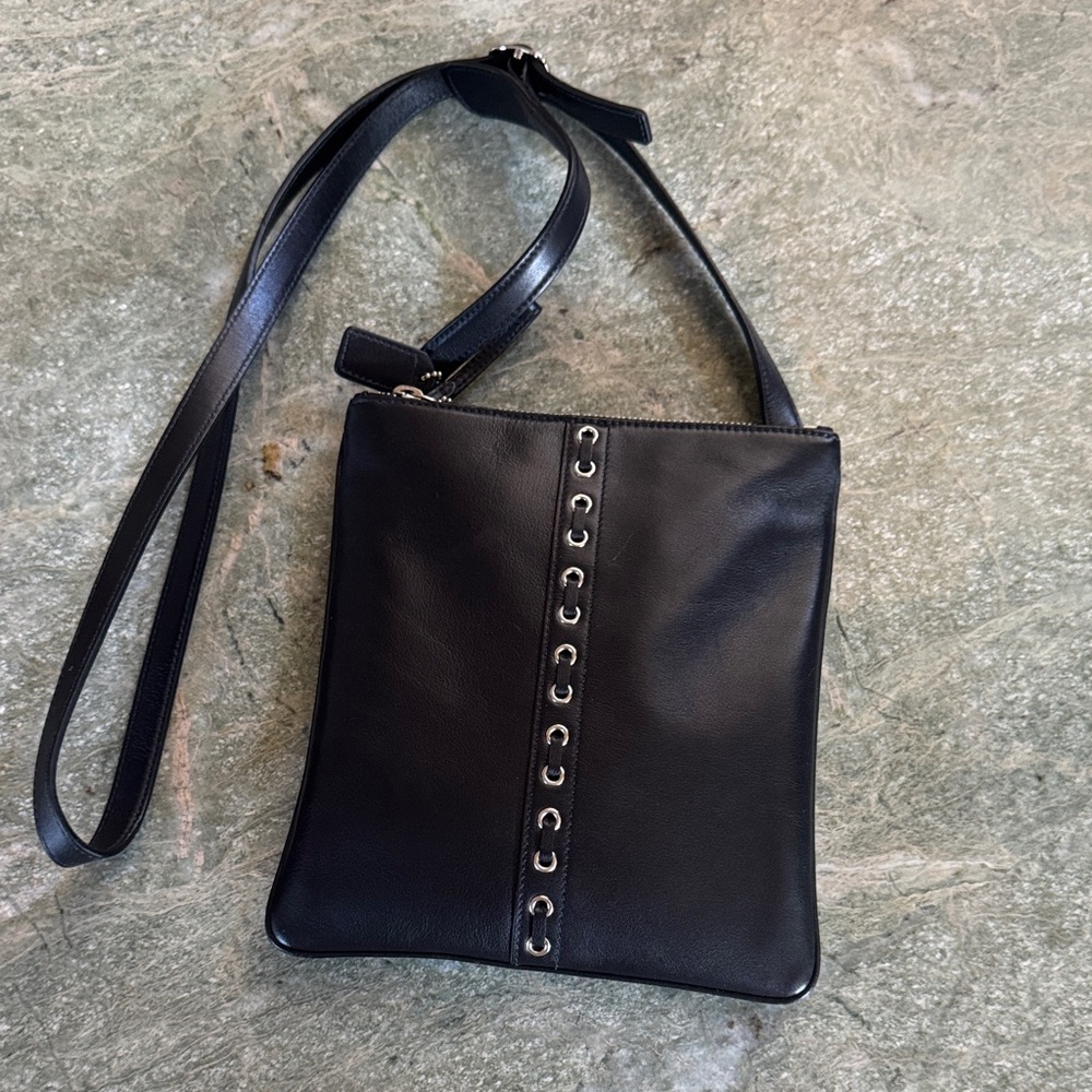 Black Leather Crossbody Bag with Grommet Accent